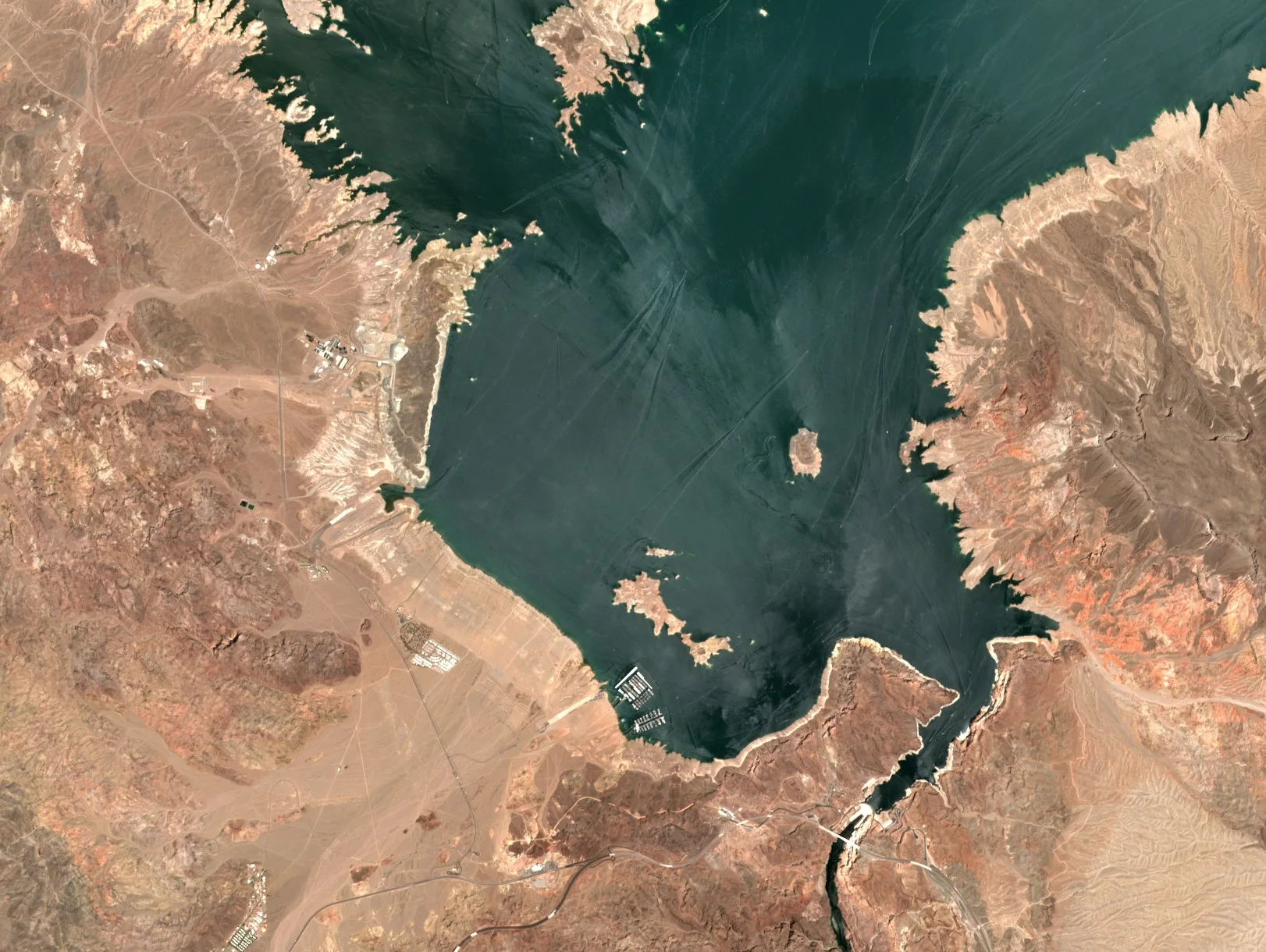 Boulder Basin of Lake Mead on 20 July 2019, with the lake reaching further into its bays and a narrower pale band of exposed shore.
