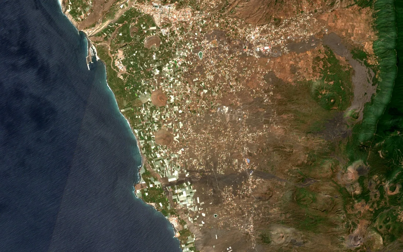 The west coast of La Palma before the eruption, with villages, roads and the pale squares of banana plantations running down to the sea