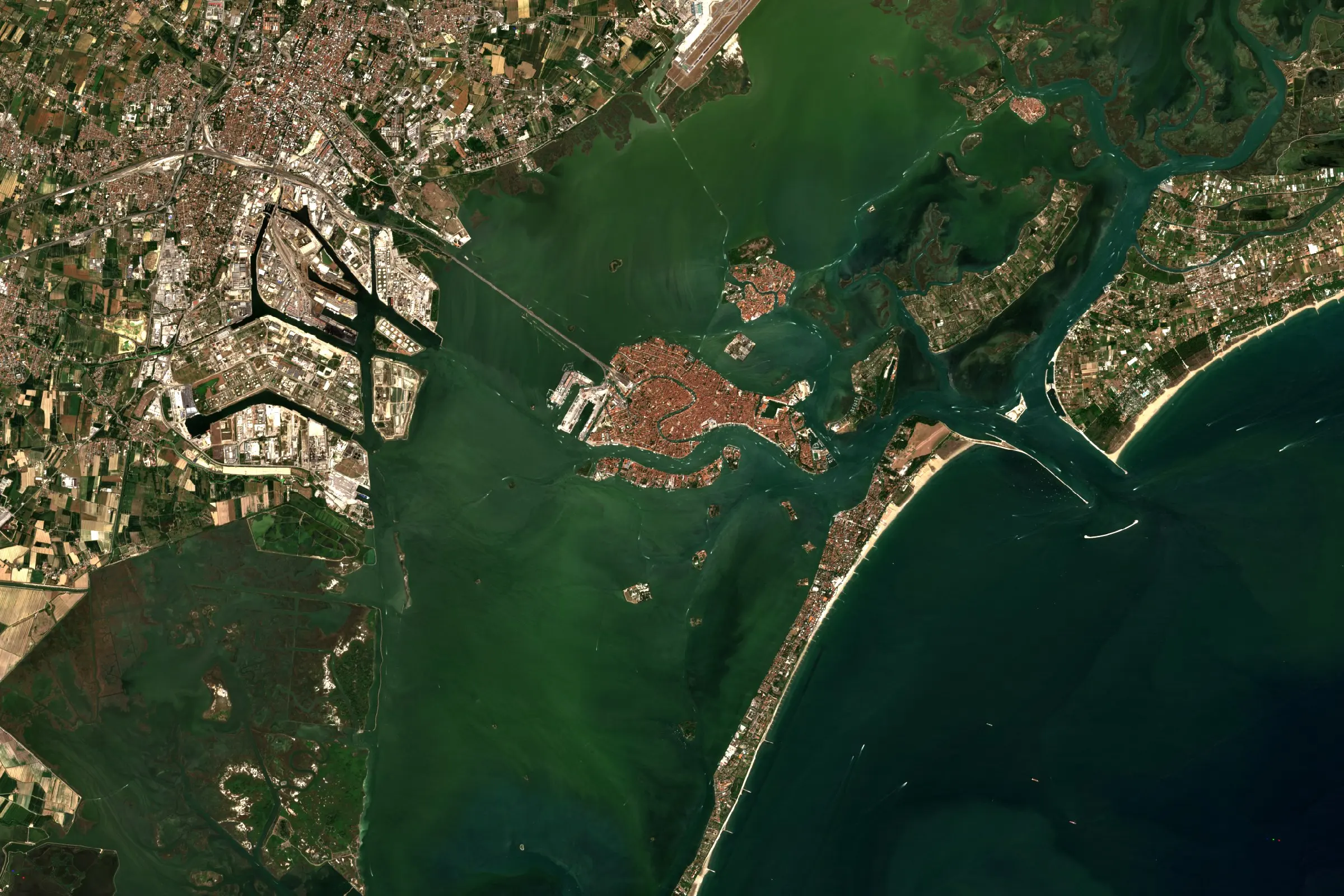 Satellite view of the Venice lagoon, with the city at its centre, the industrial port of Marghera to the west and the barrier islands against the Adriatic